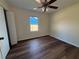 Bedroom with wood flooring, a window and neutral colored walls at 3055 Kirkland St, Deltona, FL 32738