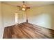 Spacious bedroom features wood flooring, ceiling fan and neutral colored walls at 3055 Kirkland St, Deltona, FL 32738