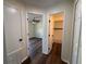 Hallway with views of the bedroom and bathroom; wood flooring at 3055 Kirkland St, Deltona, FL 32738