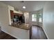 Modern kitchen featuring granite countertops, stainless steel appliances and wood flooring at 3055 Kirkland St, Deltona, FL 32738