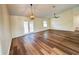 Spacious living room with new hardwood floors, ceiling fan, and French doors to the backyard at 3055 Kirkland St, Deltona, FL 32738