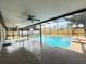 Inviting pool area featuring a screened enclosure, perfect for relaxation and enjoyment at 3055 Kirkland St, Deltona, FL 32738