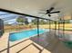 Inviting pool area featuring a screened enclosure, perfect for relaxation and enjoyment at 3055 Kirkland St, Deltona, FL 32738