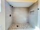Updated walk-in shower features modern tile and black fixtures at 3055 Kirkland St, Deltona, FL 32738