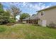 Expansive backyard featuring lush green lawn and inviting seating area, perfect for outdoor relaxation and entertaining at 315 Desoto Cir, Orlando, FL 32804