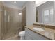 Bathroom with glass enclosed shower, tile floors, granite counters and neutral walls at 315 Desoto Cir, Orlando, FL 32804