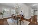 Dining room features modern artwork, wood floors, and lots of natural light at 315 Desoto Cir, Orlando, FL 32804