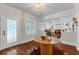 Bright foyer with wood floors, a decorative rug, and views into living spaces at 315 Desoto Cir, Orlando, FL 32804