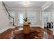 Foyer showcasing hardwood floors, a chandelier, and staircase at 315 Desoto Cir, Orlando, FL 32804