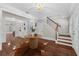 Elegant foyer with wood floors, staircase, chandelier, and decorative rug at 315 Desoto Cir, Orlando, FL 32804