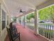 Relaxing front porch with rocking chairs and a brick floor at 315 Desoto Cir, Orlando, FL 32804