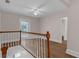 Bright hallway features wood flooring, white railings, and a French door leading to a balcony at 315 Desoto Cir, Orlando, FL 32804