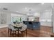 Spacious kitchen with dining area and island, featuring stainless steel appliances and ample counter space at 315 Desoto Cir, Orlando, FL 32804