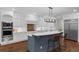 Bright kitchen with modern appliances, center island, and breakfast bar, perfect for casual dining at 315 Desoto Cir, Orlando, FL 32804