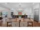 Eat-in kitchen featuring white cabinetry, stainless steel appliances, and an island with pendant lighting at 315 Desoto Cir, Orlando, FL 32804