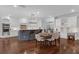 Well-lit kitchen with stainless steel appliances, a center island with seating, and white cabinetry at 315 Desoto Cir, Orlando, FL 32804