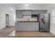 A bonus kitchenette includes cabinets, stainless fridge, sink, granite counters and a microwave at 315 Desoto Cir, Orlando, FL 32804
