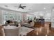 Bright and open living room flows into kitchen with stainless appliances and a dining area at 315 Desoto Cir, Orlando, FL 32804