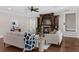 Elegant living room featuring a fireplace, hardwood floors, built in shelving, and stylish furniture at 315 Desoto Cir, Orlando, FL 32804
