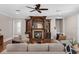 Elegant living room featuring a fireplace, hardwood floors, built in shelving, and stylish furniture at 315 Desoto Cir, Orlando, FL 32804