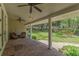 Spacious covered patio featuring brick flooring, ceiling fans, and an outdoor seating area overlooking the yard at 315 Desoto Cir, Orlando, FL 32804