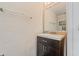 Cozy powder room with a stylish vanity, mirror and neutral wall decor at 328 Fairfield Dr, Sanford, FL 32771