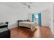 Bright bedroom featuring wood floors, a ceiling fan, and a window providing natural light at 328 Fairfield Dr, Sanford, FL 32771