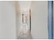 Well-lit hallway with marble floors, arched doorways, and neutral walls at 328 Fairfield Dr, Sanford, FL 32771