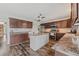 Spacious kitchen featuring modern appliances, an island, and sleek granite countertops at 328 Fairfield Dr, Sanford, FL 32771