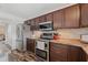 Updated kitchen with sleek cabinets, stainless steel appliances, and granite countertops at 328 Fairfield Dr, Sanford, FL 32771