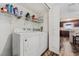 Functional laundry room with appliances and shelving for storage and organization at 328 Fairfield Dr, Sanford, FL 32771