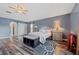 Large main bedroom features wood floors, generous space, and windows providing ample natural light at 328 Fairfield Dr, Sanford, FL 32771
