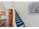 Carpeted stairway leading to the upper level of the home with white walls at 328 Fairfield Dr, Sanford, FL 32771