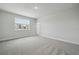 Neutral bedroom featuring carpet, window, and white walls at 353 Belmond Dr, Debary, FL 32713