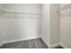Walk-in closet includes neutral carpeting, white walls, and wire rack shelving system at 353 Belmond Dr, Debary, FL 32713