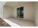 Relax on this covered patio with sliding glass doors and concrete flooring at 353 Belmond Dr, Debary, FL 32713