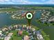 Stunning aerial view of lakefront homes, showcasing a community surrounded by beautiful lakes and green spaces at 3774 Eagle Isle Cir, Kissimmee, FL 34746