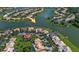 Gorgeous aerial view highlighting a waterfront home with lake access in a quiet neighborhood at 3774 Eagle Isle Cir, Kissimmee, FL 34746