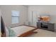 Bedroom with neutral walls, tile floor, modern TV, and good natural light, offering comfortable private space at 3774 Eagle Isle Cir, Kissimmee, FL 34746