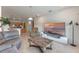 Open-concept living room featuring tile floors, a TV, and seamless flow into the kitchen at 3774 Eagle Isle Cir, Kissimmee, FL 34746