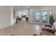 Spacious living room with tile floors, French doors to the patio and comfortable seating at 3774 Eagle Isle Cir, Kissimmee, FL 34746