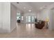 Open living room with tile flooring and French doors that open to the outdoor patio at 3774 Eagle Isle Cir, Kissimmee, FL 34746