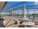 Large screened patio with outdoor seating and a serene lake view, ideal for relaxation at 3774 Eagle Isle Cir, Kissimmee, FL 34746