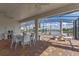 Covered patio featuring beautiful brick flooring, screened enclosure, and serene lake views for outdoor enjoyment at 3774 Eagle Isle Cir, Kissimmee, FL 34746