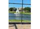Relaxing water view of lake with sailboat as seen from screened lanai with brick patio at 3774 Eagle Isle Cir, Kissimmee, FL 34746