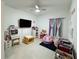 Bright ' bedroom featuring a desk, toy storage, and a cozy beanbag chair at 4295 Twisted Twig Bnd, Kissimmee, FL 34746