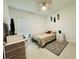 Cozy bedroom featuring neutral tones, ceiling fan, and a window with blinds at 4295 Twisted Twig Bnd, Kissimmee, FL 34746