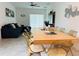 Bright dining area with a large table and comfortable seating, seamlessly integrated with the living space at 4295 Twisted Twig Bnd, Kissimmee, FL 34746