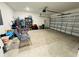 Spacious garage featuring an automatic door and ample storage space at 4295 Twisted Twig Bnd, Kissimmee, FL 34746