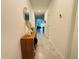 Light-filled hallway boasts stylish decor and leads to the living areas of the home at 4295 Twisted Twig Bnd, Kissimmee, FL 34746